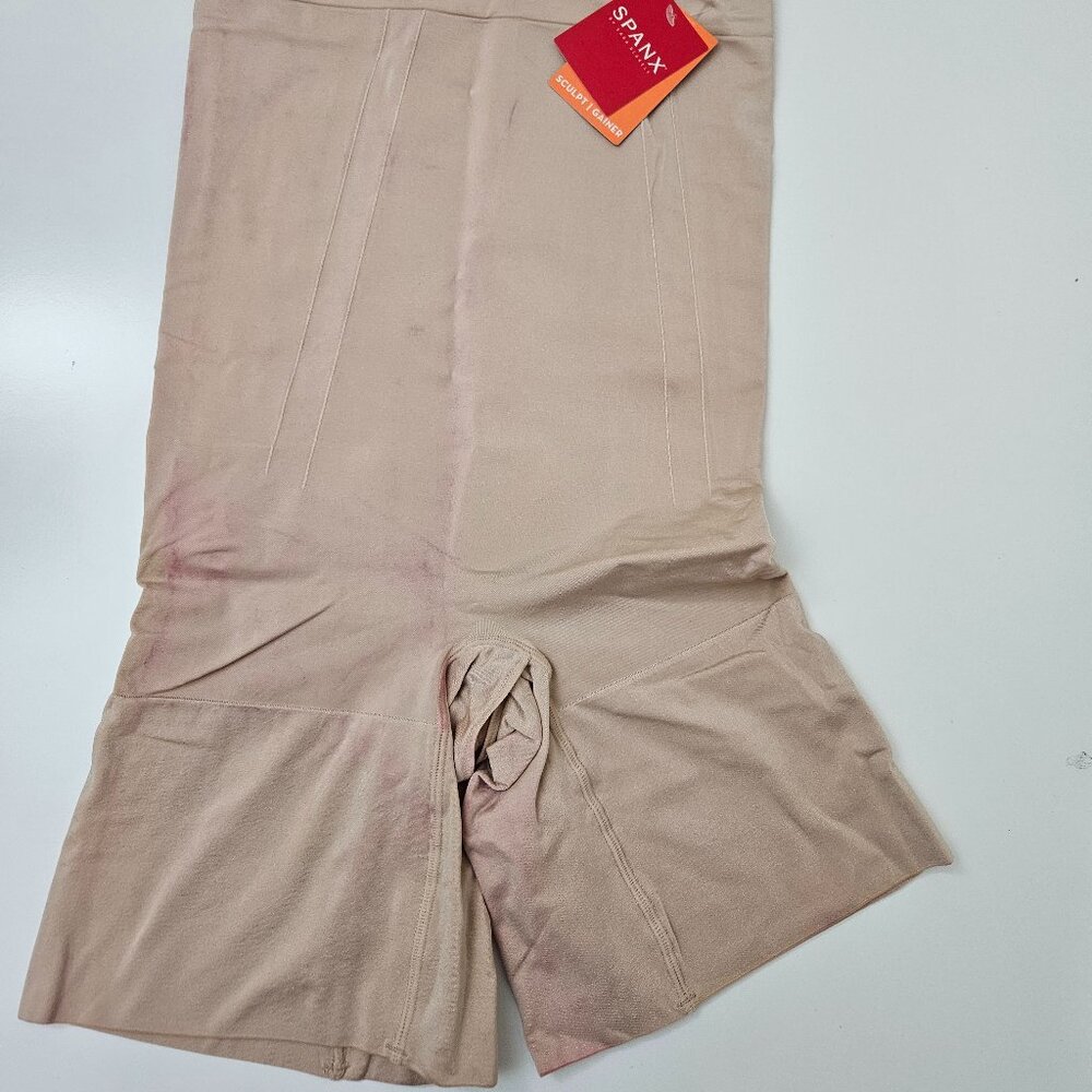 41. Spanx High waist mid-thigh short. NWT but stained.